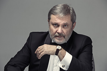 Image showing Senior Businessman sitting in chair