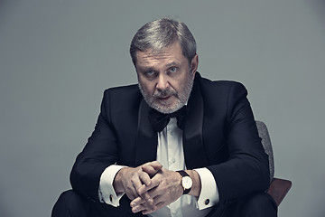 Image showing Senior Businessman sitting in chair