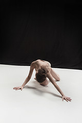 Image showing Young teen dancer on white floor background.