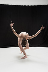 Image showing Young teen dancer on white floor background.