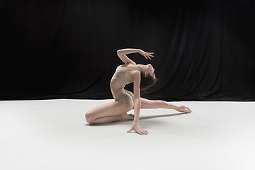 Image showing Young teen dancer on white floor background.