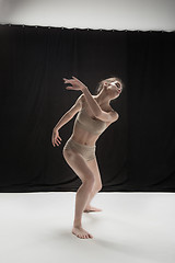 Image showing Young teen dancer on white floor background.