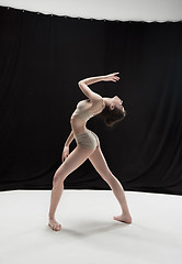 Image showing Young teen dancer on white floor background.