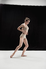 Image showing Young teen dancer on white floor background.