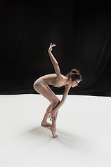 Image showing Young teen dancer on white floor background.