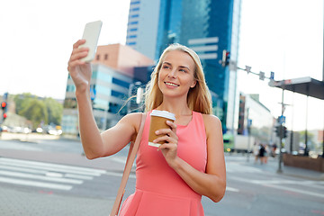 Image showing woman with coffee taking selfie by smartphone