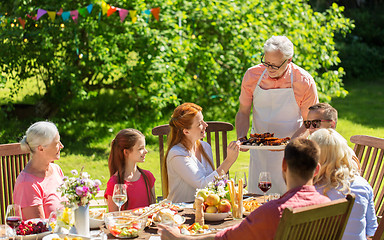 Image showing happy family having dinner or summer garden party