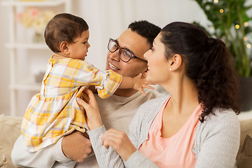 Image showing happy family with baby daughter at home