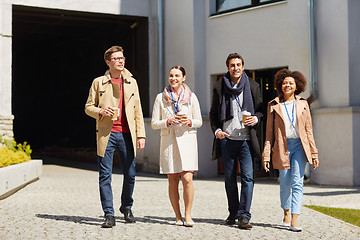 Image showing office workers with coffee on city street