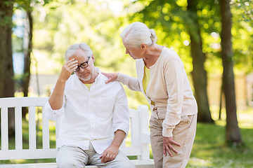 Image showing senior man suffering from headache outdoors