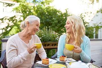 Image showing daughter with senior mother drinking tea at cafe