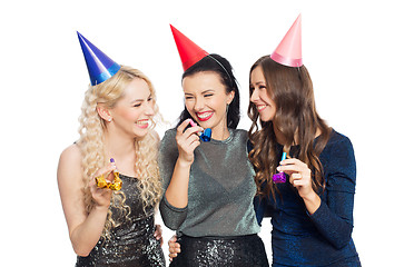 Image showing happy women with party caps hugging