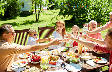 Image showing happy family having dinner or summer garden party