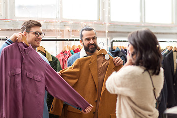 Image showing friends photographing at vintage clothing store