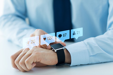 Image showing hands with smart watch and social media icons
