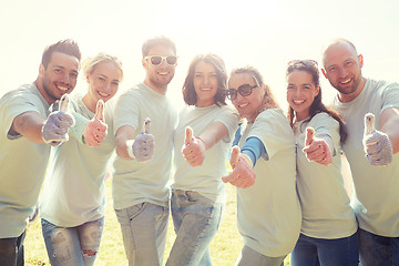 Image showing group of volunteers showing thumbs up outdoors