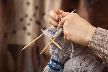 Image showing hands of woman knitting a sock