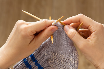 Image showing hands knitting a sock