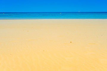 Image showing European sandy beach and blue sea.