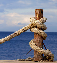 Image showing Rope on seafront and cloudy sky in autumn evening