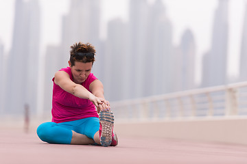 Image showing woman stretching and warming up