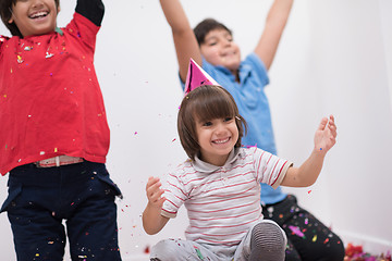 Image showing kids  blowing confetti