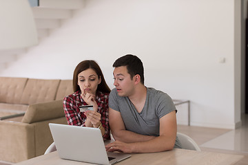 Image showing happy young couple buying online