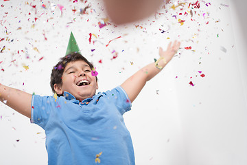 Image showing kid blowing confetti