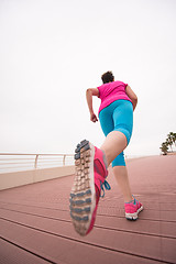 Image showing woman busy running on the promenade