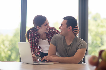 Image showing happy young couple buying online