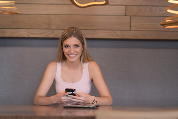 Image showing young woman using mobile phone