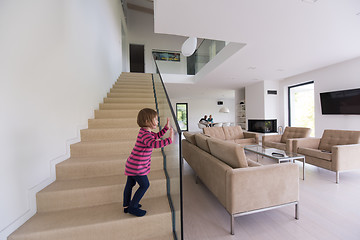 Image showing family with little girl enjoys in the modern living room