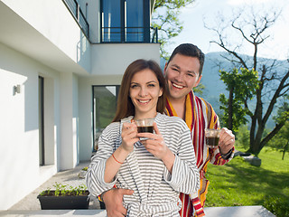 Image showing Young beautiful couple in bathrobes