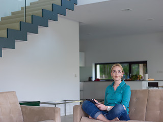 Image showing woman on sofa using tablet computer