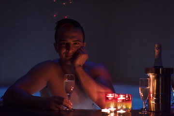 Image showing man relaxing in the jacuzzi