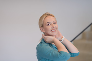 Image showing portrait of a young beautiful woman on the stairs