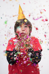 Image showing kid blowing confetti