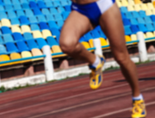 Image showing Blurred athletic running competition at stadium not in focus