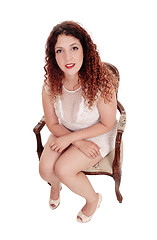 Image showing Beautiful young woman sitting in chair