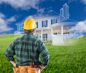 Image showing Contractor Standing Outdoors Looking Over Grass Site with Ghoste