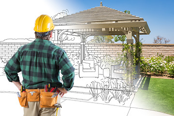 Image showing Contractor Standing Looking At Patio Pergola Design Drawing and 