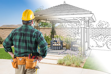 Image showing Contractor Standing Looking At Patio Pergola Design Drawing and 