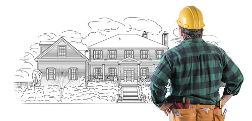 Image showing Male Contractor with Hard Hat and Tool Belt Looking At Custom Ho