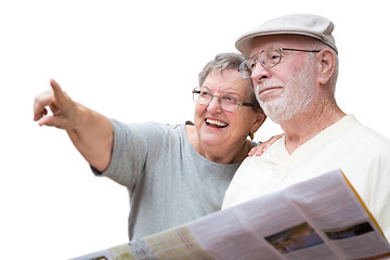 Image showing Happy Senior Adult Couple with Brochure Pointing Isolated on a W