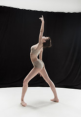 Image showing Young teen dancer on white floor background.