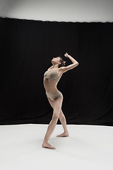 Image showing Young teen dancer on white floor background.