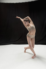 Image showing Young teen dancer on white floor background.