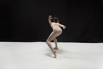 Image showing Young teen dancer on white floor background.