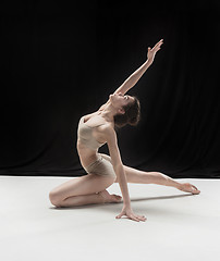 Image showing Young teen dancer on white floor background.