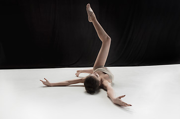 Image showing Young teen dancer on white floor background.